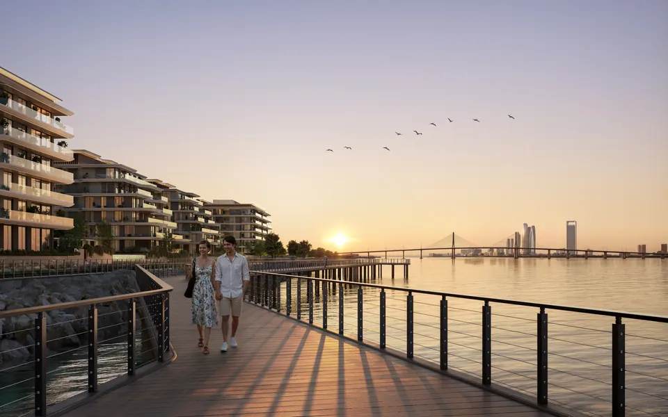 Bashayer Residences: boardwalk at sunset with the city skyline, developer render