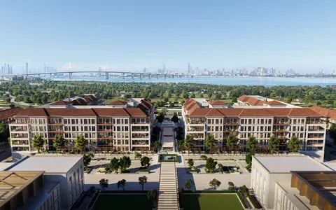 Nawayef Park Views: aerial view of the apartment blocks with terracotta roofs and the Abu Dhabi skyline beyond, developer render