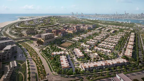Nawayef Village: aerial view over the townhouse streets towards the Abu Dhabi skyline, developer render