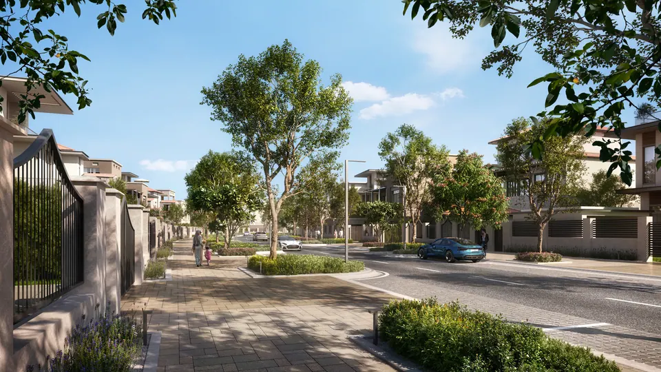 Wadeem: tree-lined residential street between villa walls, developer render
