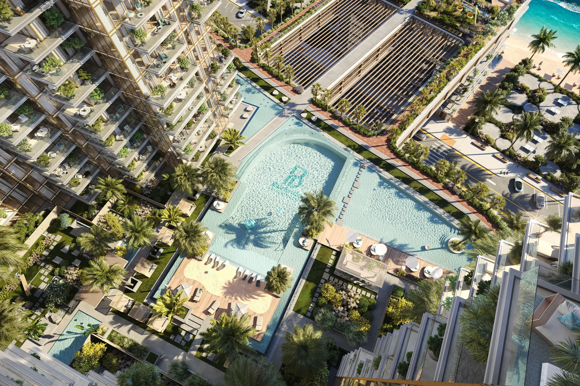 Aerial view of the sixth-floor podium: the lagoon-style pool with a sandy beach edge, cabanas and palms, and the beach beyond