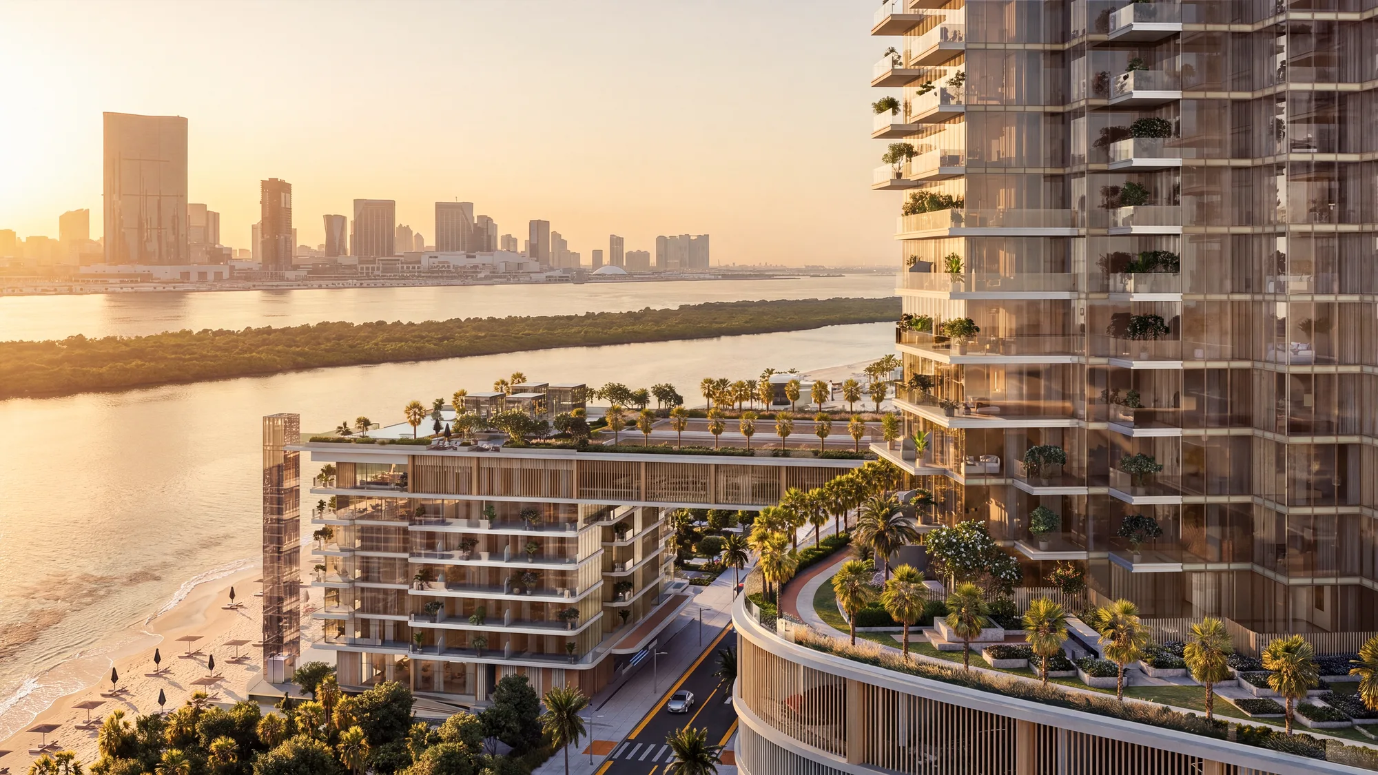 The Beach Club on the shoreline beside the podium's curved edge, with the mangroves and the city skyline across the water at sunset