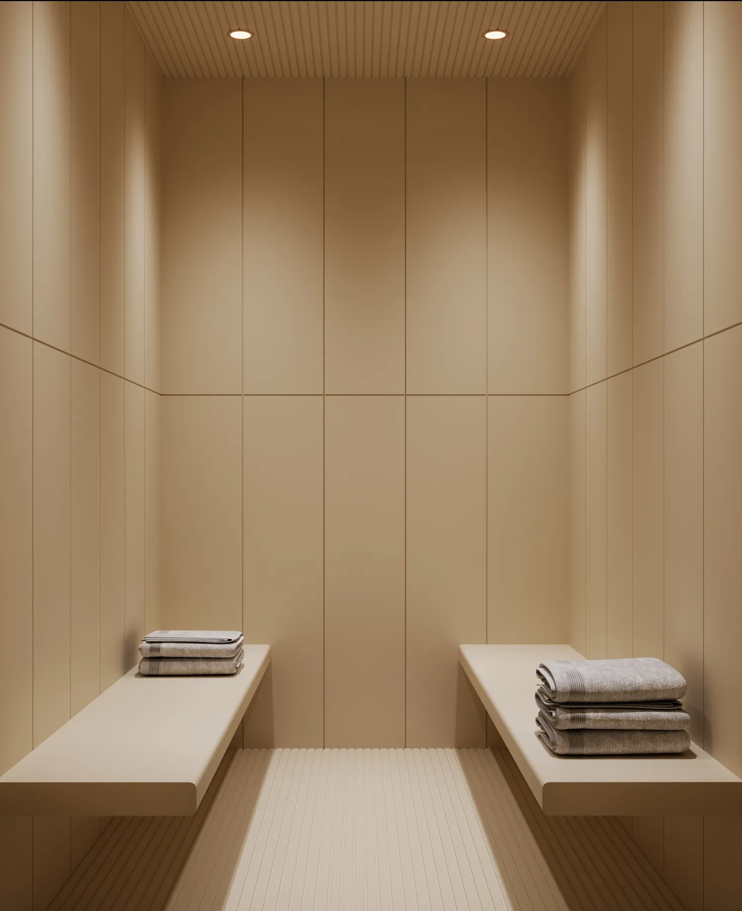 The steam room: two stone benches with rolled towels in a timber-lined alcove