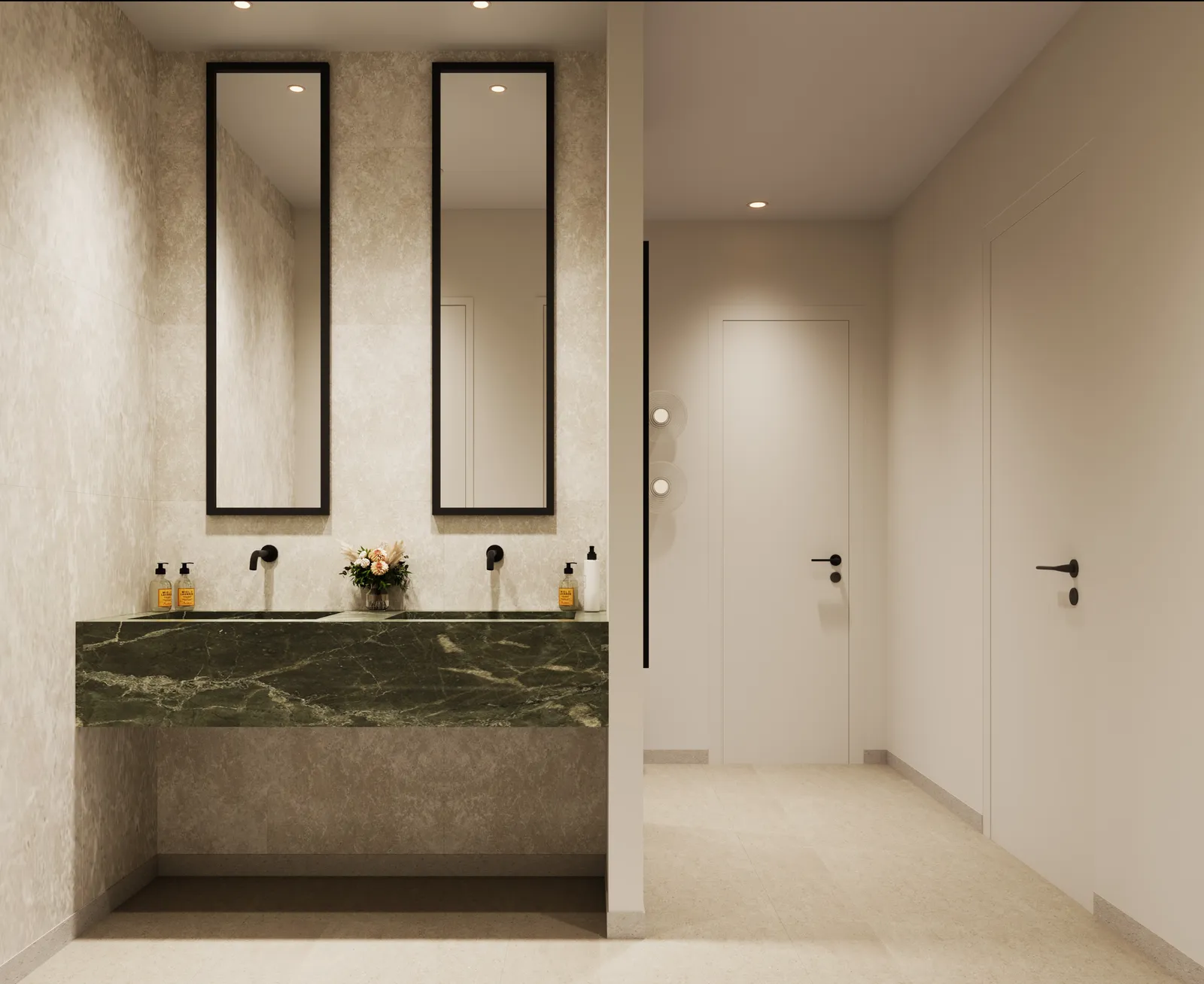 The changing-room vanity: a green marble double basin under two tall black-framed mirrors, with cubicle doors beyond
